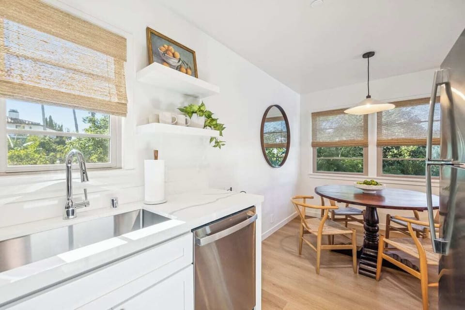 Full kitchen: Coffee drip, fridge, stove/oven, plates and utensils, dishwasher
