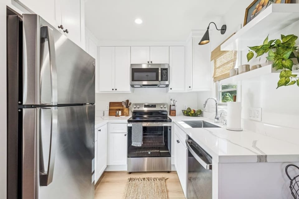Full kitchen: Coffee drip, fridge, stove/oven, plates and utensils, dishwasher