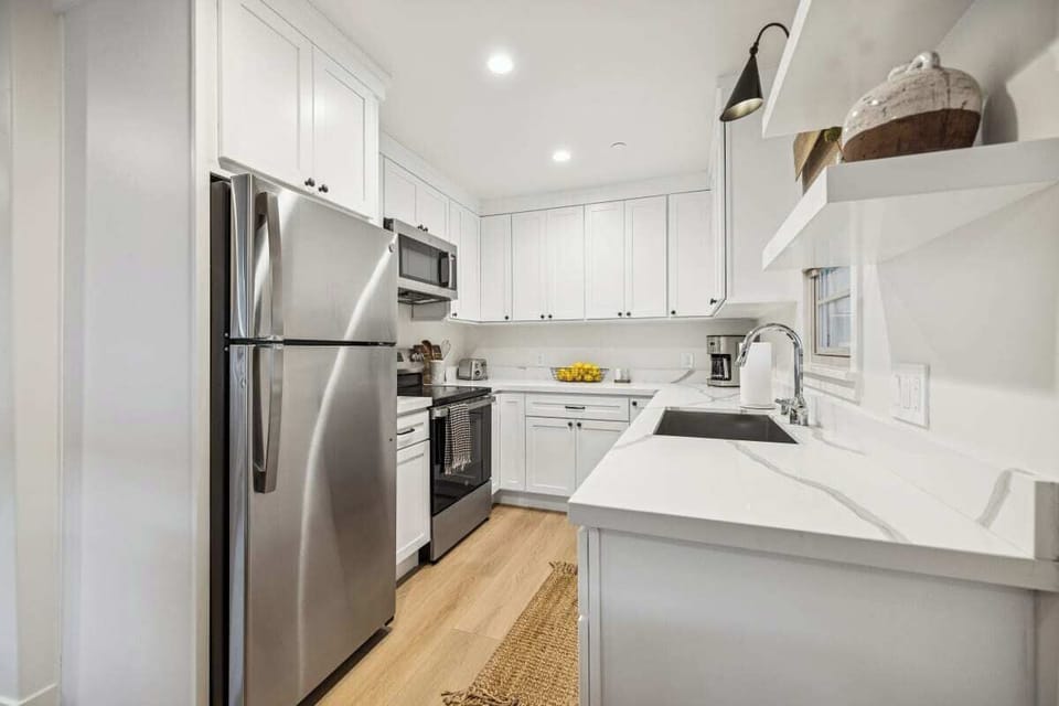 Full kitchen: Coffee drip, fridge, stove/oven, plates and utensils, dishwasher