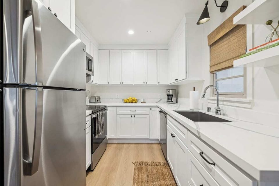 Full kitchen: Coffee drip, fridge, stove/oven, plates and utensils, dishwasher