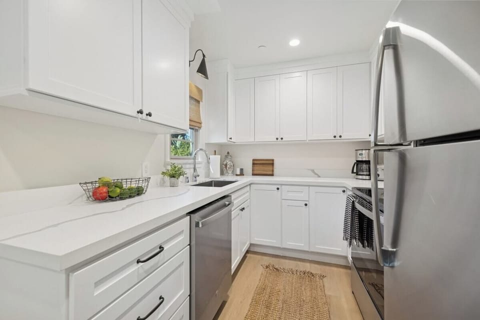 Full kitchen: Coffee drip, fridge, stove/oven, plates and utensils, dishwasher