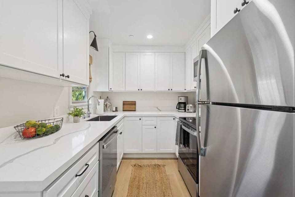 Full kitchen: Coffee drip, fridge, stove/oven, plates and utensils, dishwasher