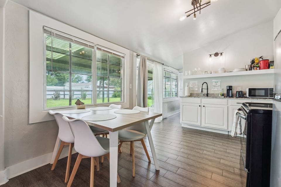 Dine with a view—this sunny window-side table comfortably seats four and looks out to the private backyard.