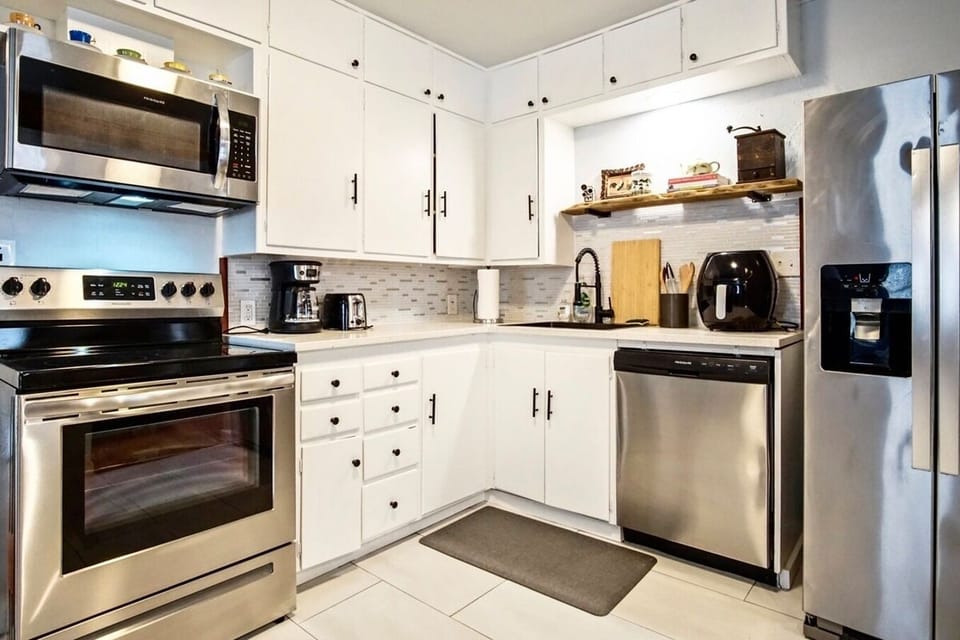 Prepare meals in a kitchen that combines elegance with convenience.