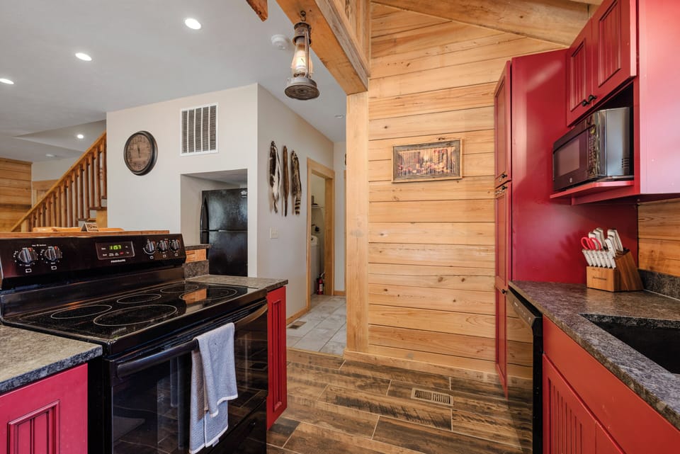 Kitchen area leading to laundry and half bath