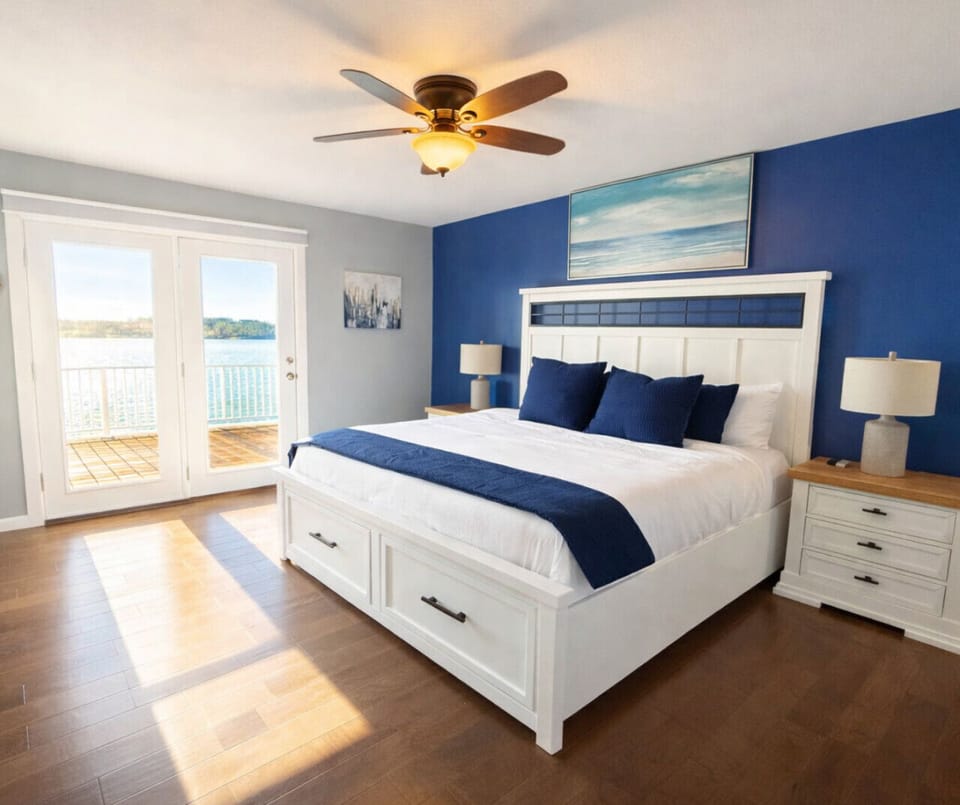 King bedroom with lake views and private deck access