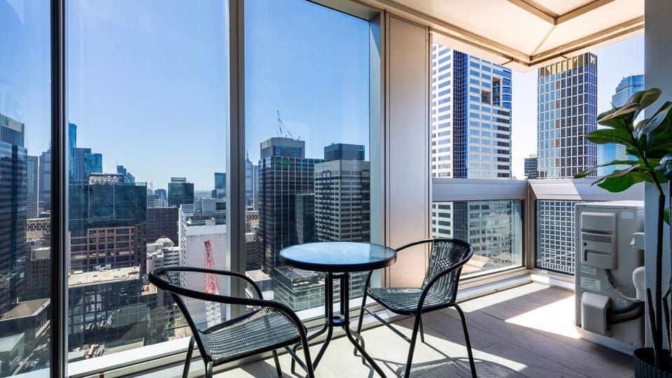 Enjoy your morning coffee or evening drinks on the private balcony with city views