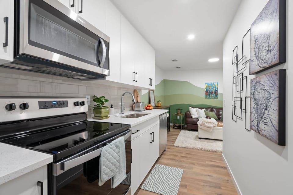 Full kitchen with living room view
