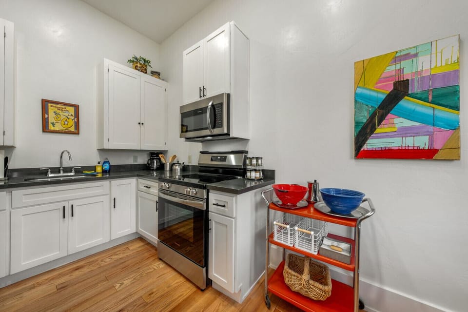 Small, but mighty kitchen space with fridge, range, oven, and microwave (no dishwasher)