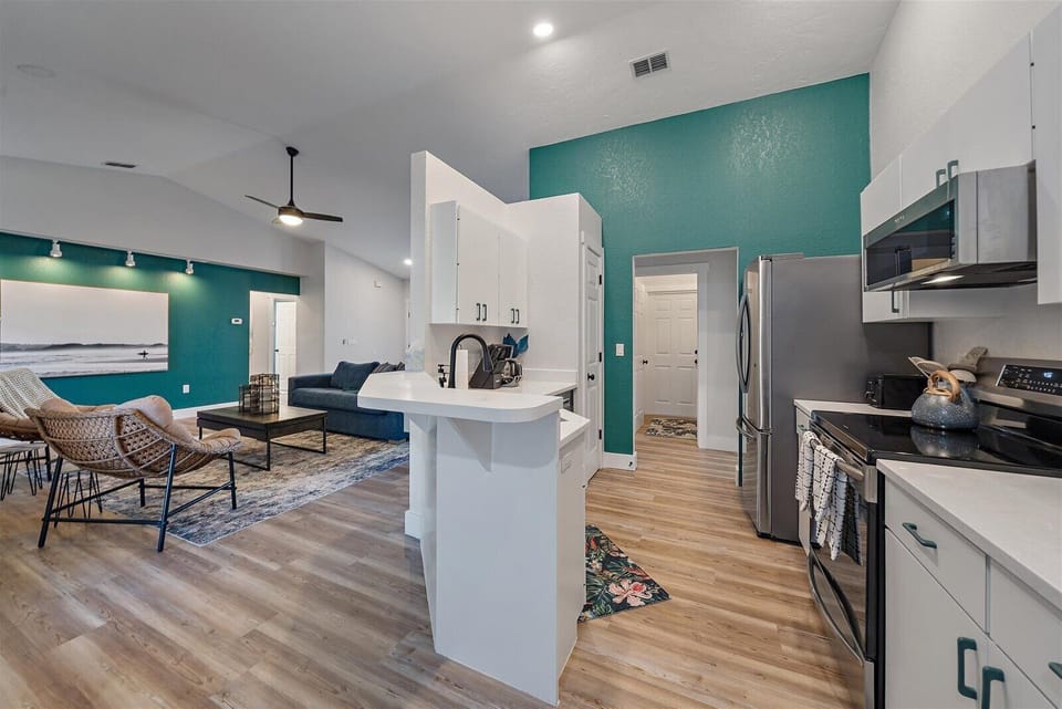 The kitchen blends seamlessly with the living and dining room spaces.