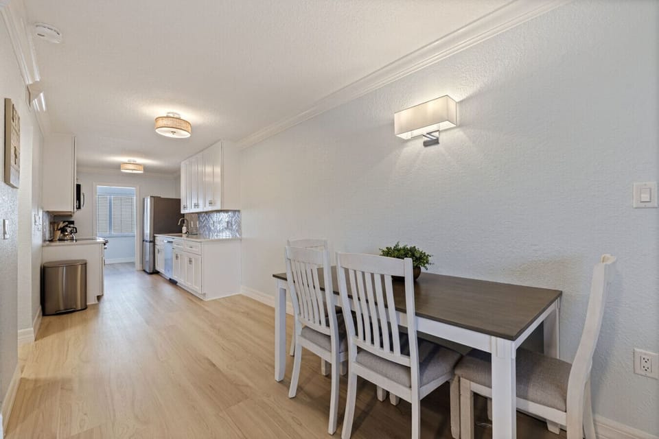 Dining area looking into the kitchen with the guest bedroom located at the far end