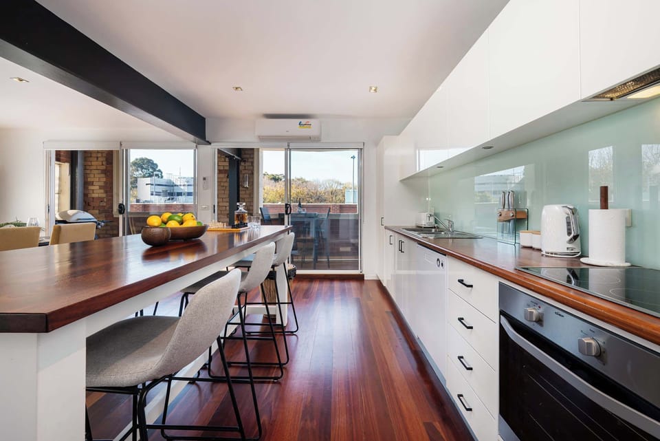 Spacious kitchen with timber benchtops