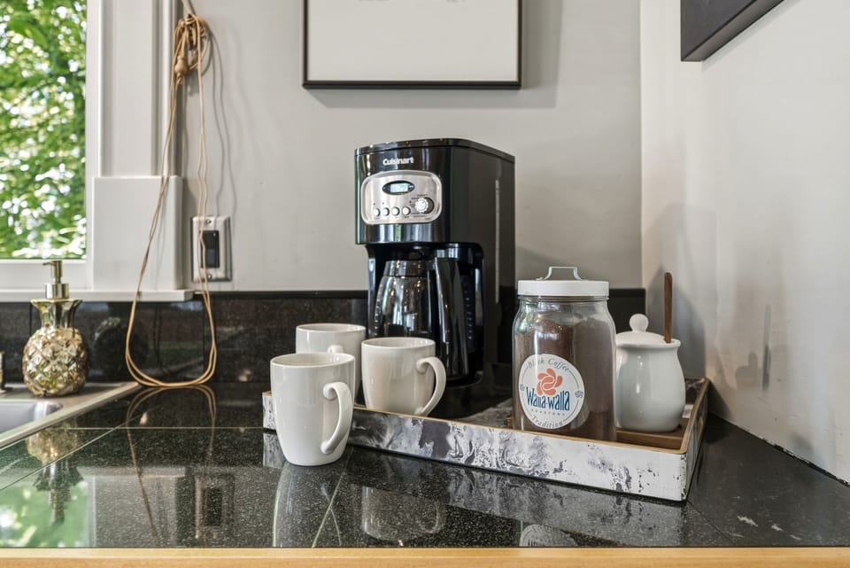 12-cup drip coffee maker and initial supply of ground coffee provided