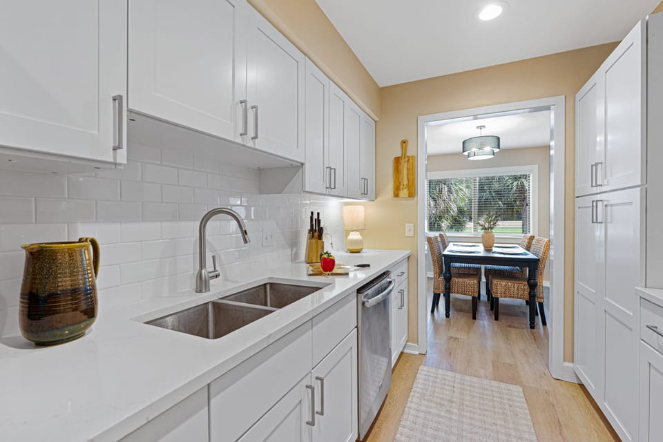 The kitchen is fully equipped for quick meals or family dinners, while the dining area provides views of the course!