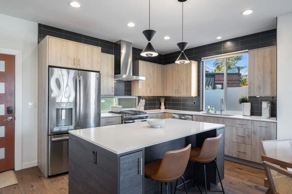 The kitchen island is perfect for breakfast before exploring and relaxed dinners after a full day around the city.