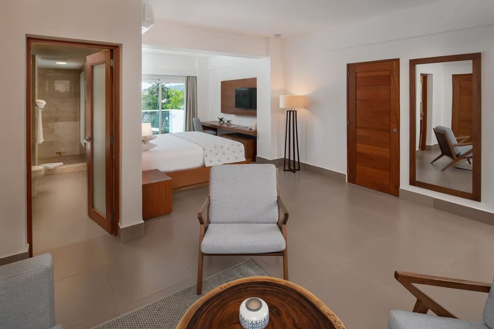 Junior Suite, Balcony, Garden View | In-room safe, blackout drapes, iron/ironing board, bed sheets