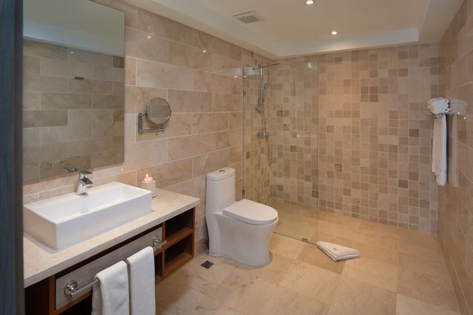 Luxury Suite, Balcony, Sea View | Bathroom | Hair dryer, towels, soap, shampoo