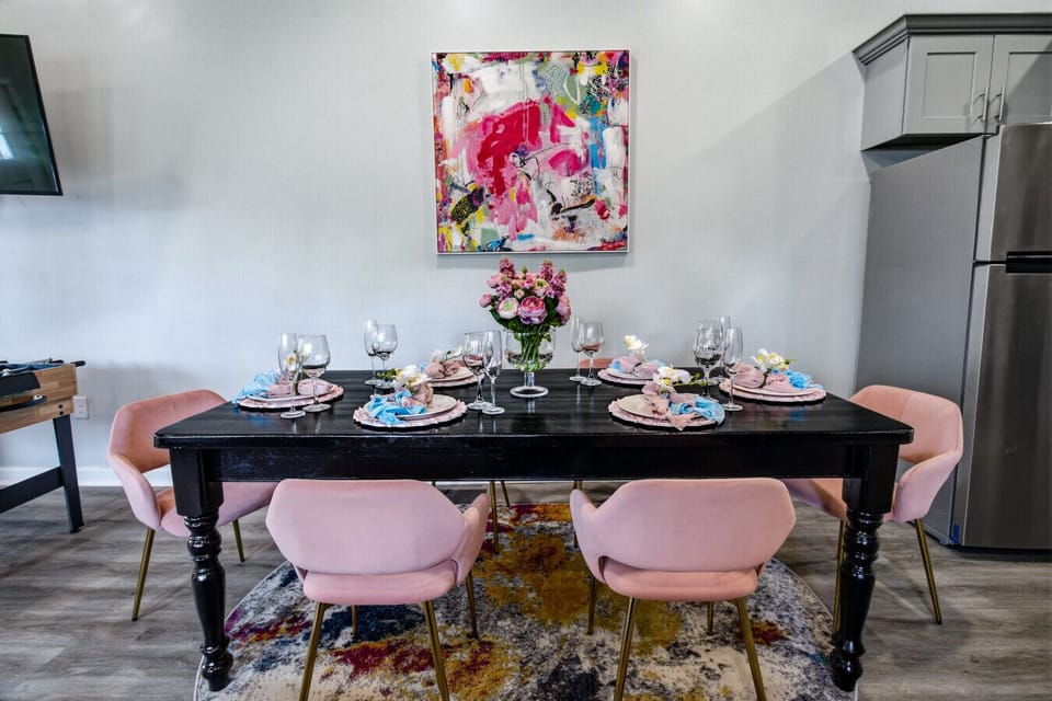 Private pink dining area with seating for 6 and elegant design