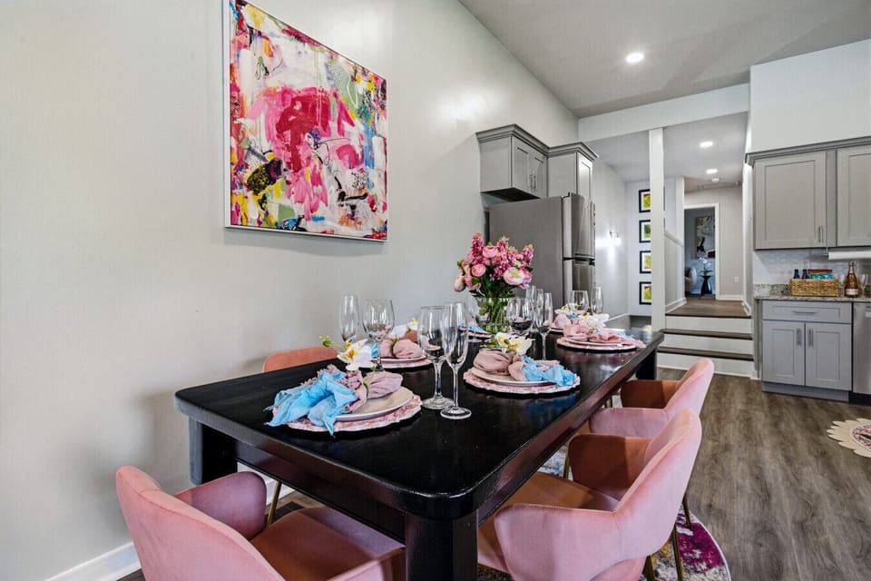 Private pink dining area with seating for 6 and elegant design