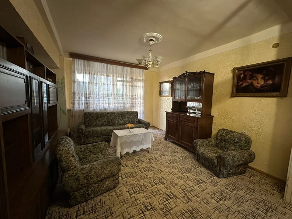 Family Apartment, City View | Living area | Flat-screen TV