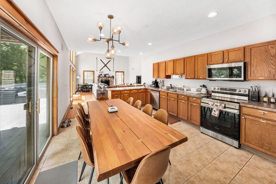 Fully stocked kitchen with a table for 12 plus bar seating. 