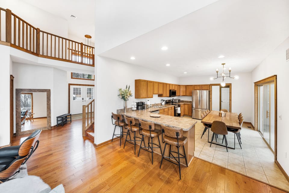 Fully stocked kitchen with a table for 12 plus bar seating. 