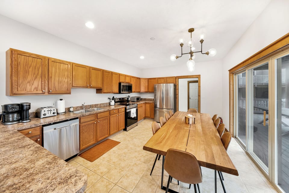 Fully stocked kitchen with a table for 12 plus bar seating. 