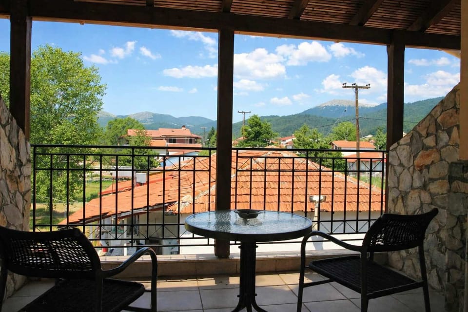 Sunny Balcony with Mountain and Village Views
Bright balcony offering clear views of the village rooftops and nearby mountains.