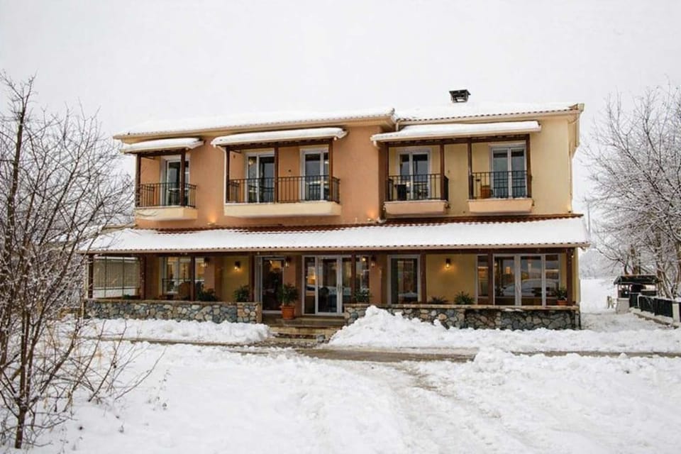 Exterior View of Ducata Rooms in Winter
Traditional guesthouse exterior surrounded by snow, showcasing the peaceful winter setting of Xiropigado.