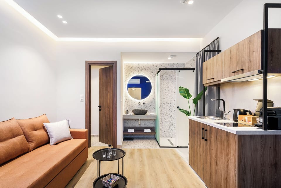 Charming compact kitchenette seamlessly integrated with a cozy living area