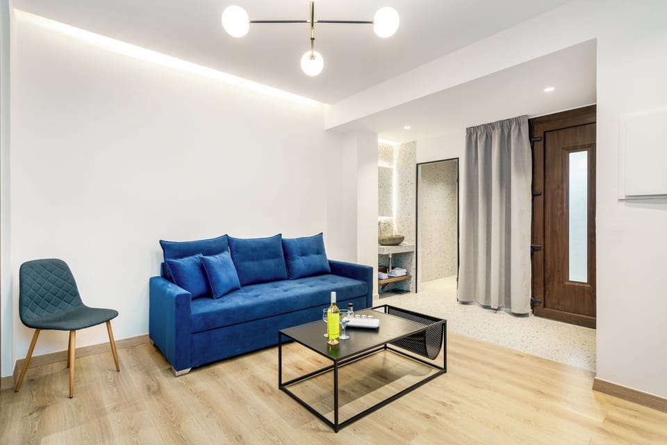 Small living room with a sofa that can be transformed into a double bed