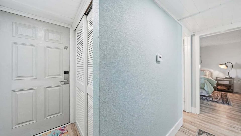 Entry way with washer/dryer in closet on the right