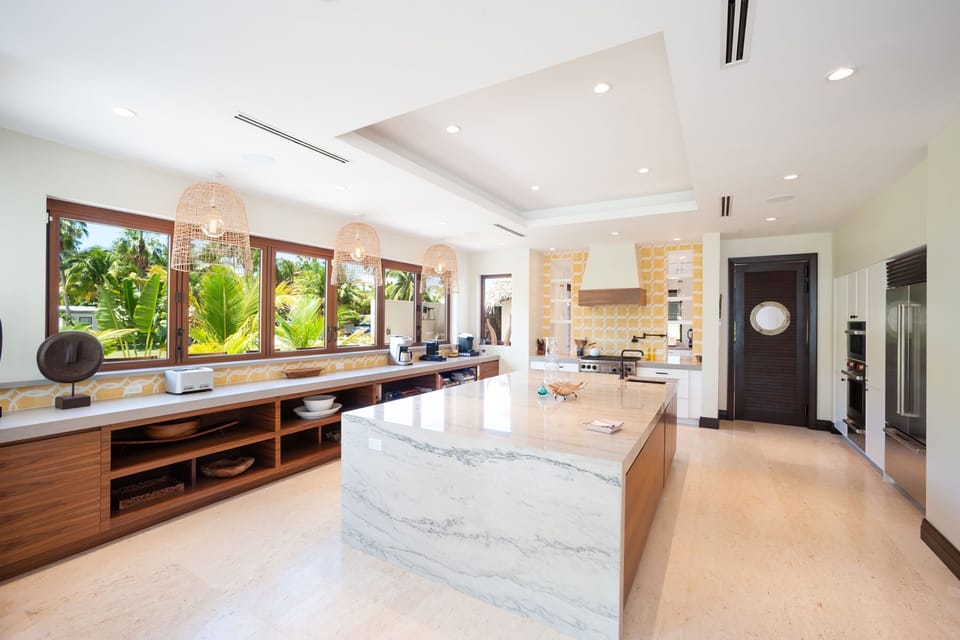 A deluxe gourmet kitchen with top of the line appliances. Hire a private chef for a night of effortless fine dining. All cookware, glassware, dishware, and cutlery comes provided. 