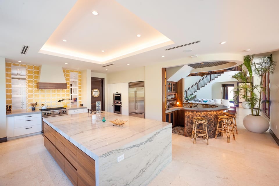 The kitchen also features a custom Havana-style bar. Add butler service to your stay and stock the bar with your favorite wine, beer, or spirits. 