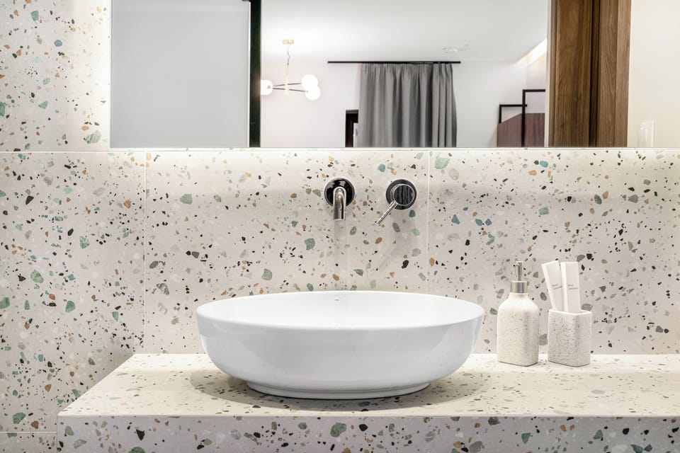 Well-lit mirror adds a touch of elegance