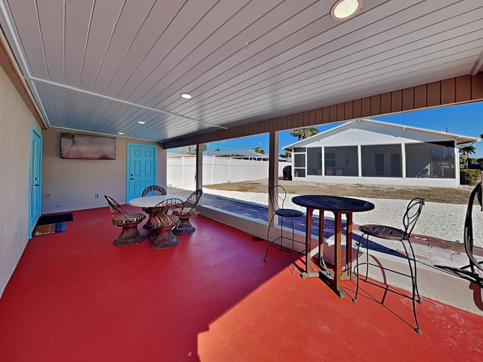 Converted Carport into an Outdoor Living Room with Dining Table + TV