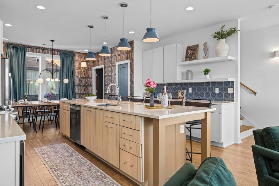 Fully Stocked Gourmet Kitchen with Island Seating and Dining Table