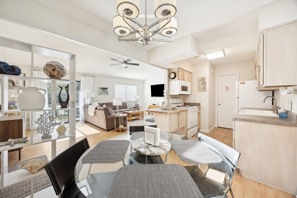 Your bright, airy space flows from kitchen to living room, perfect for relaxing with modern amenities and stylish decor.