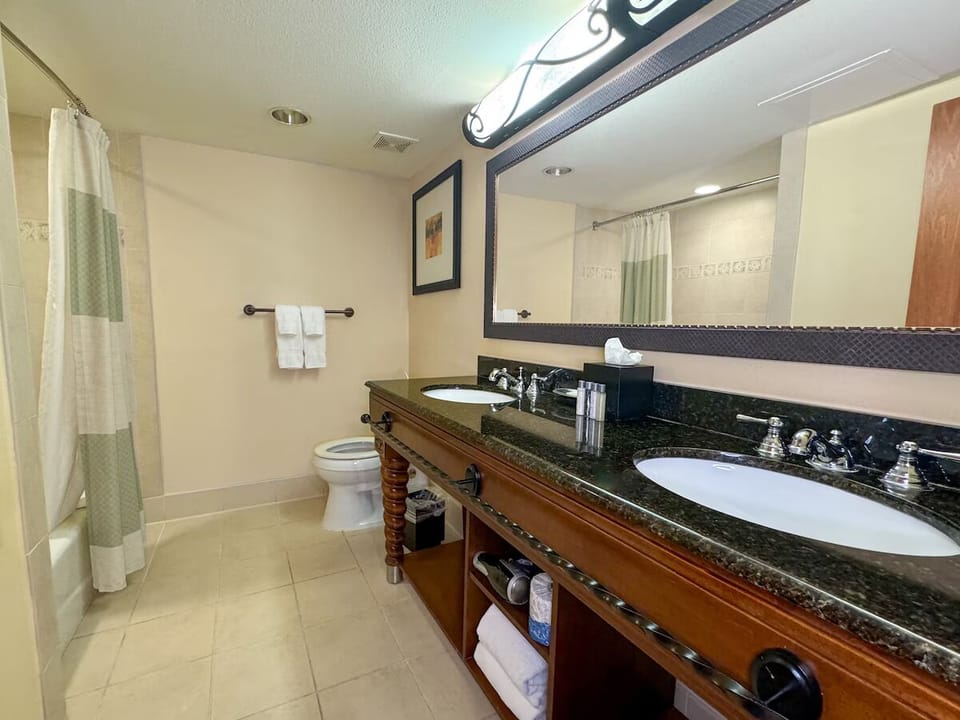 Rinse off and recharge in the spotless, well-lit bathroom.