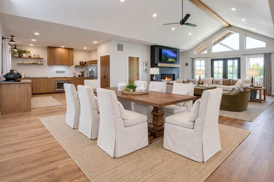 Designed for togetherness, this bright open space blends the living room, dining area, and kitchen which is ideal for group conversations, shared meals, and cozy nights.