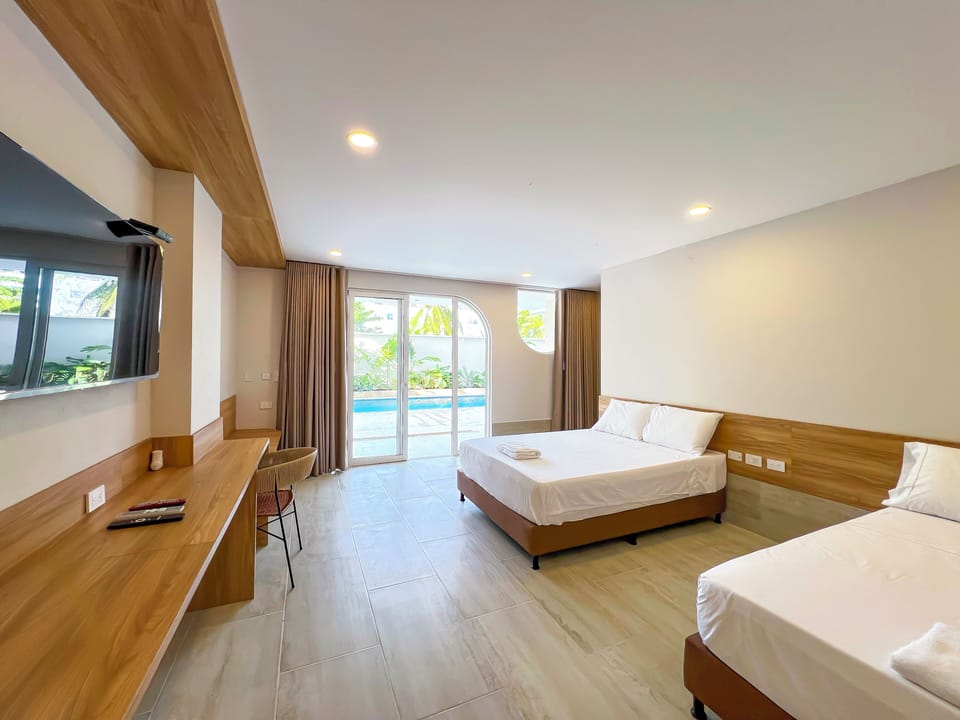 Comfort Quadruple Room, Pool View | Hypo-allergenic bedding, desk, laptop workspace, free WiFi
