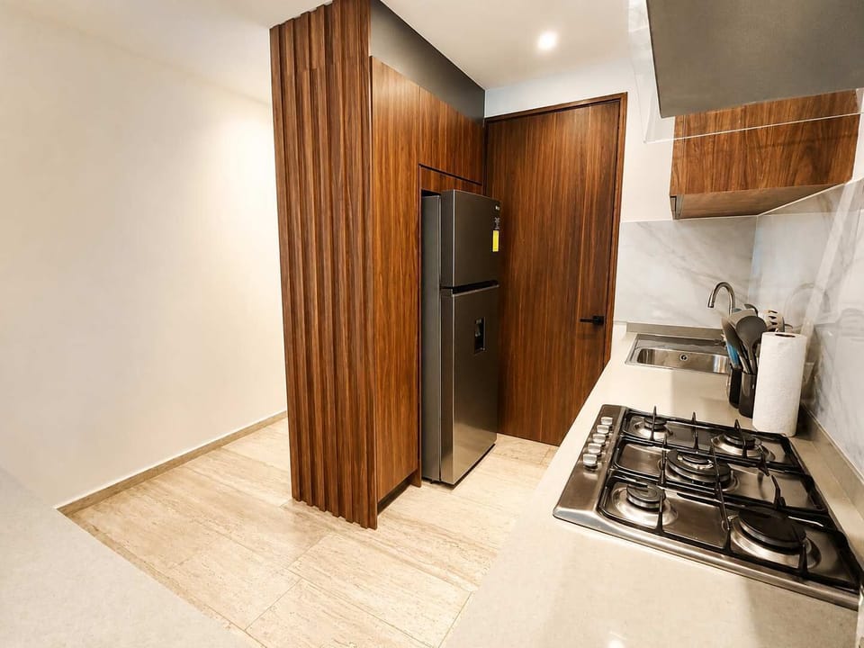 Cocina moderna y equipada con electrodomésticos premium para estancias largas o gourmet lovers