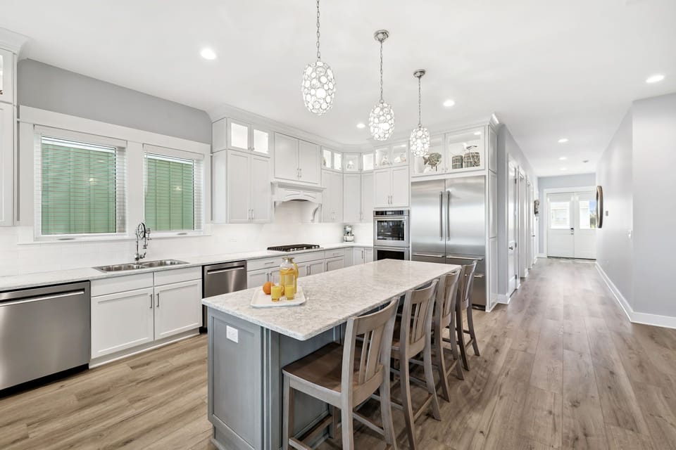 Cook and gather in your spacious gourmet kitchen, where elegant pendant lights illuminate quality time with loved ones.