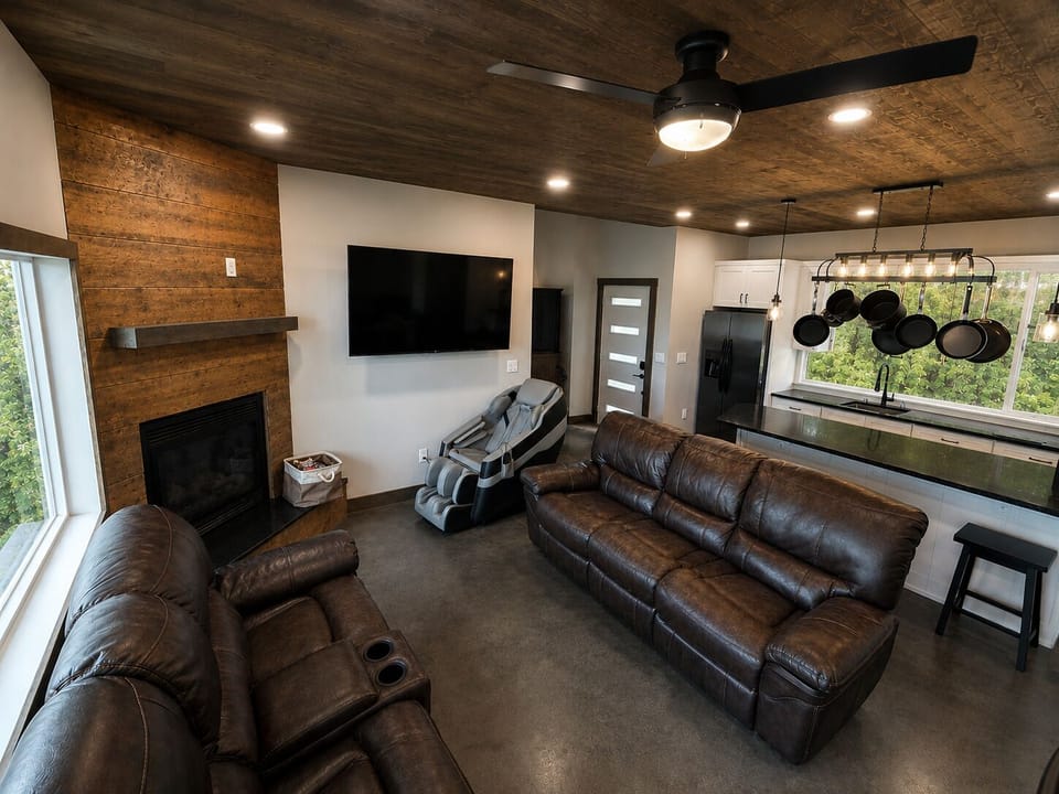 Comfortable living room with view of lake, massage chair,  fireplace & QLED TV!