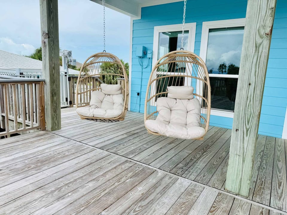 Relax over the water on the bay in the swing chairs.