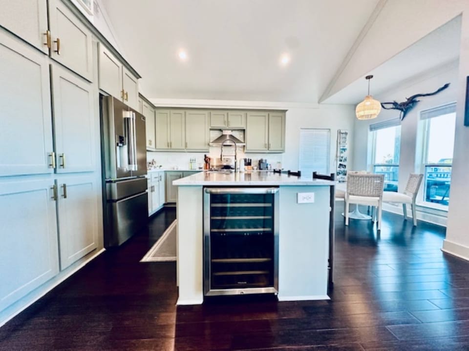 open concept kitchen with its own wine fridge