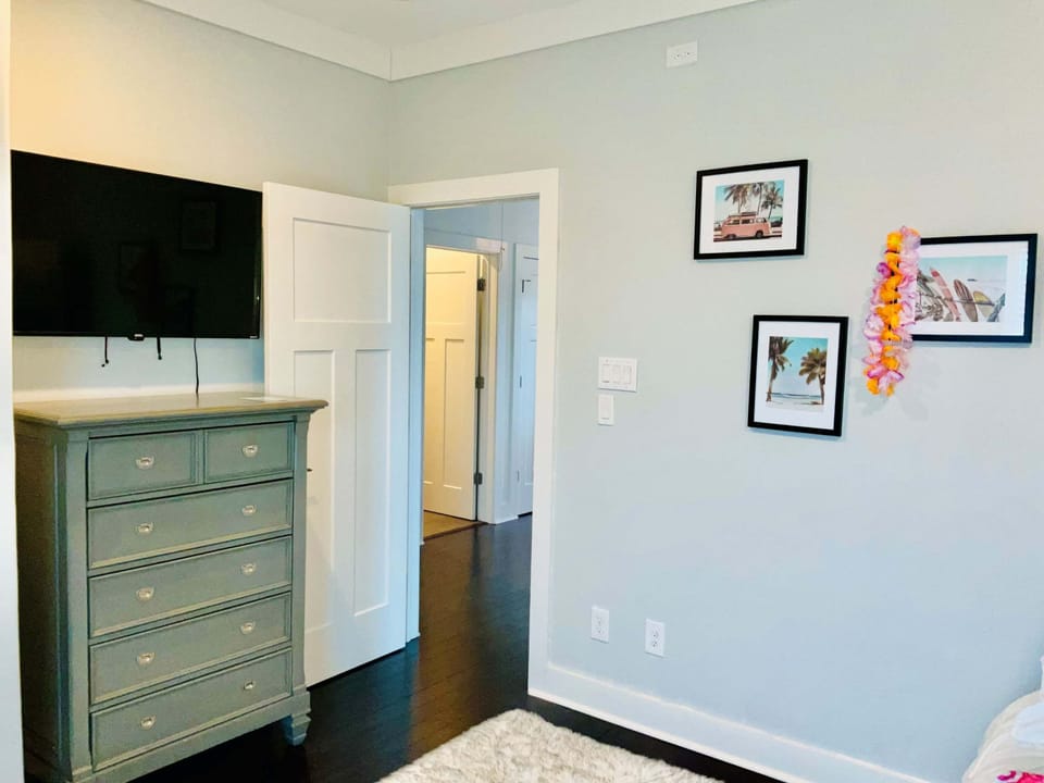 A twin-over-full bunkbed with twin trundle & smart TV await in the third bedroom​