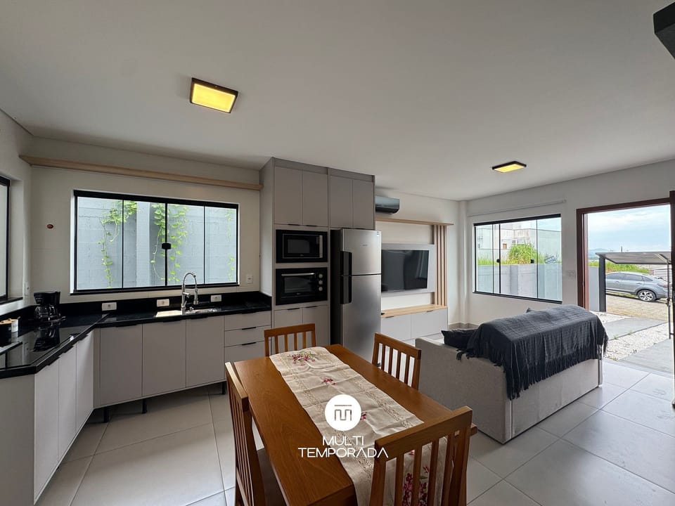 Premium House | Private kitchen | Fridge, microwave, cookware/dishes/utensils, dining table