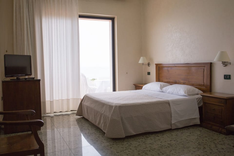 Classic Double or Twin Room, Sea View | Down comforters, minibar, in-room safe, individually decorated
