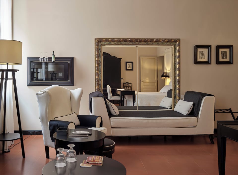 Deluxe Room | Living area | Flat-screen TV